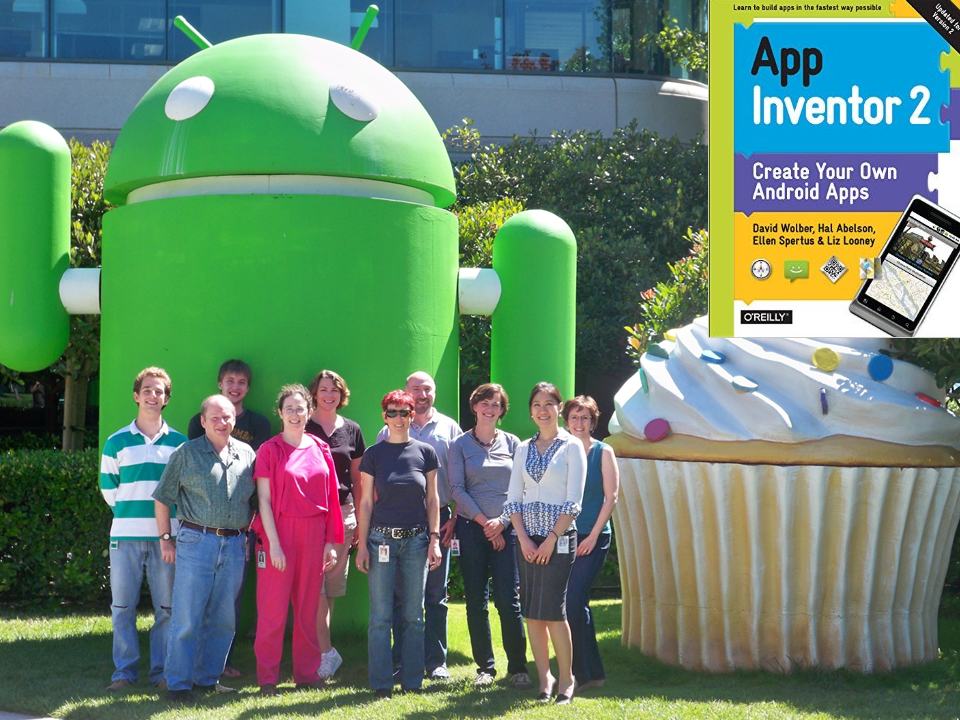 Ten people, including Prof. Spertus, standing in front of an Android sculpture at Google. An inset shows the cover of the book App Inventor 2